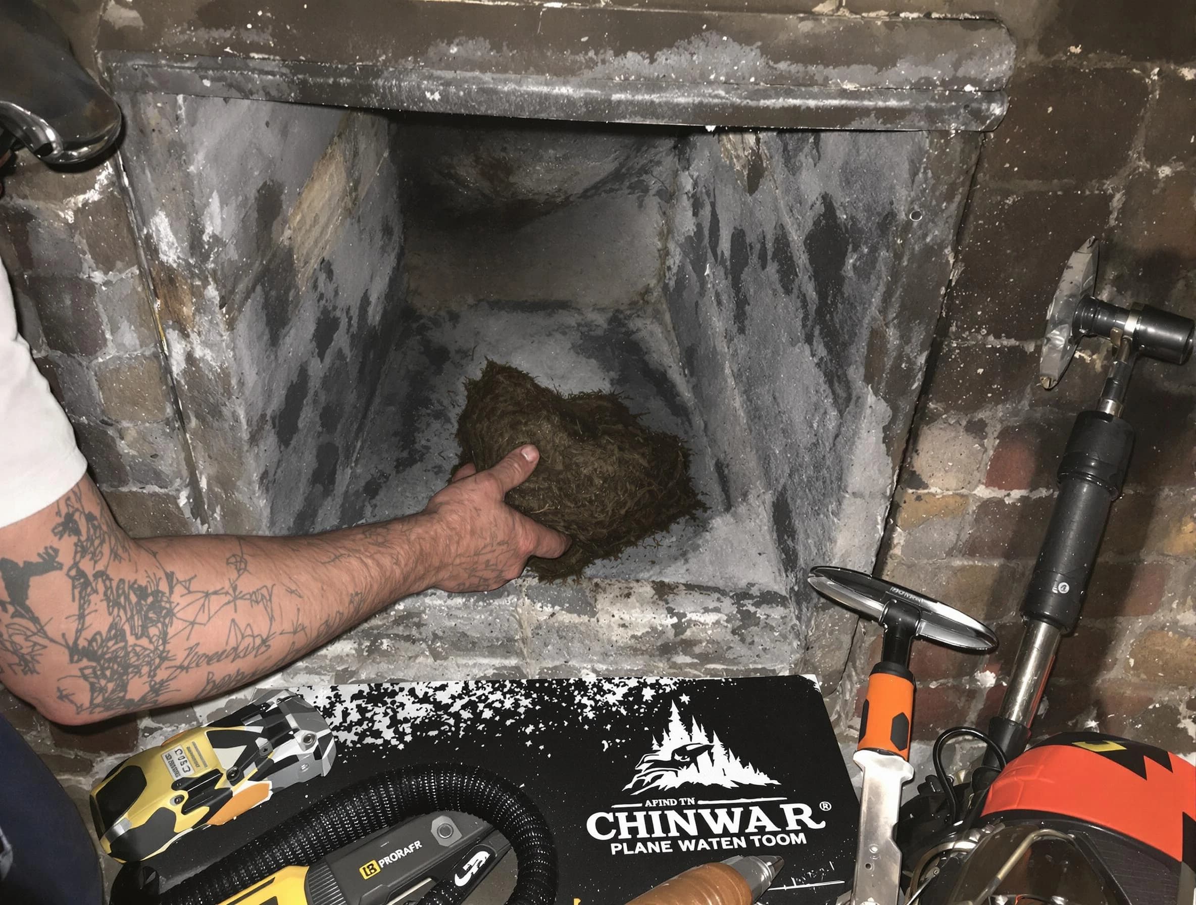 Homewood Chimney Sweep safely removing debris and screening chimney in Homewood, AL
